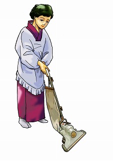 画像：掃除機を使う女性